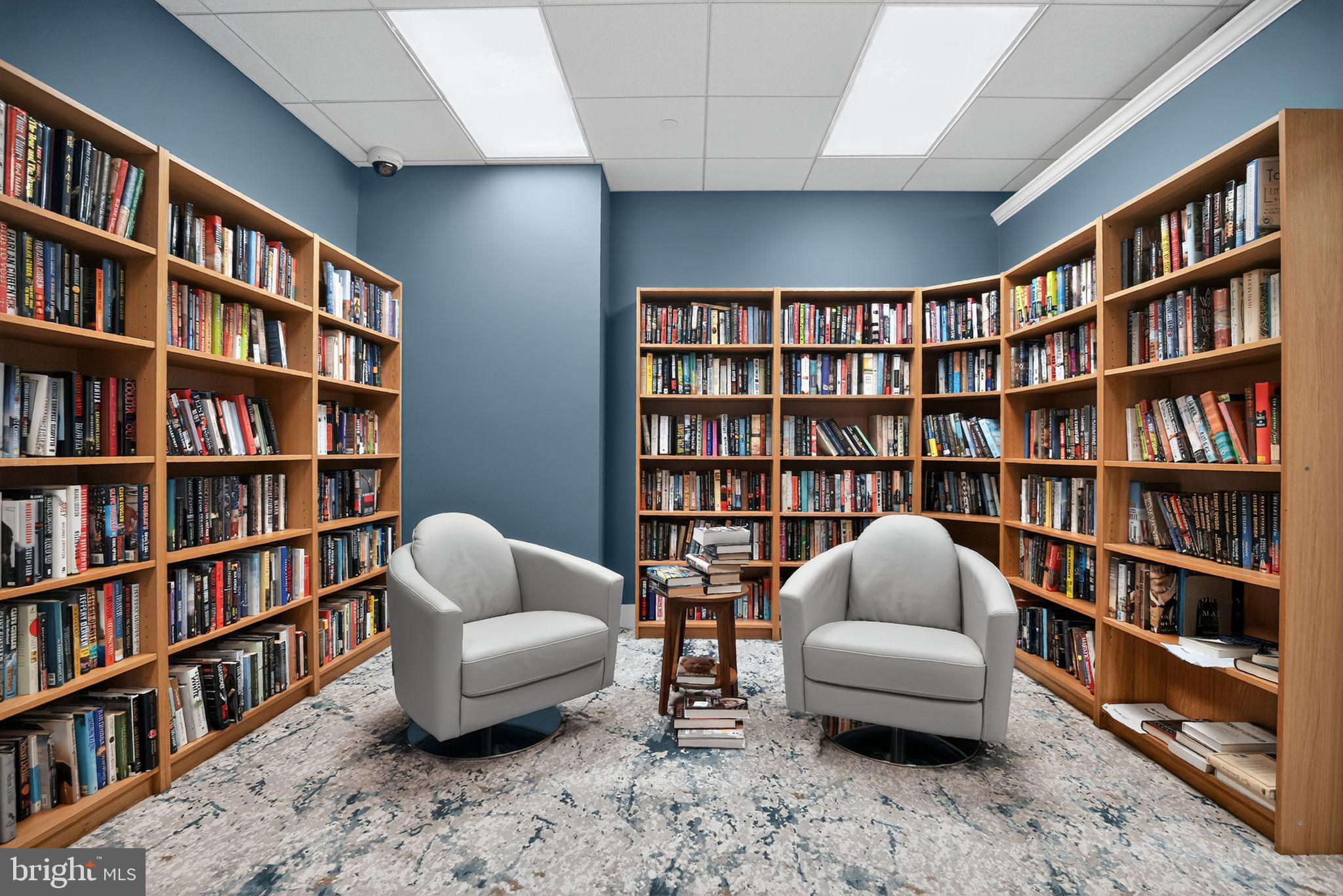 1919 Chestnut Street, Unit 707 Philadelphia, PA 19103 - Photo 31 of 36 a living room with furniture and a book shelf