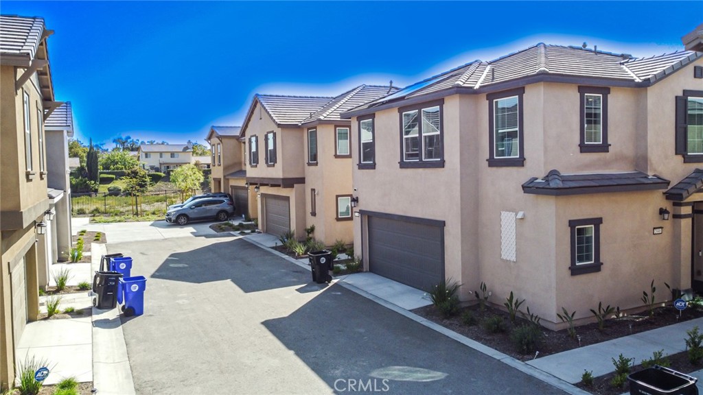 2448 Powell Drive Rialto, CA 92377 - Photo 16 of 30 a front view of a house with a yard