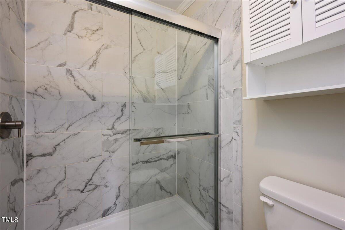 5662 Hamstead Crossing Raleigh, NC 27612 - Photo 19 of 31 Tile shower in Bedroom 1 En Suite