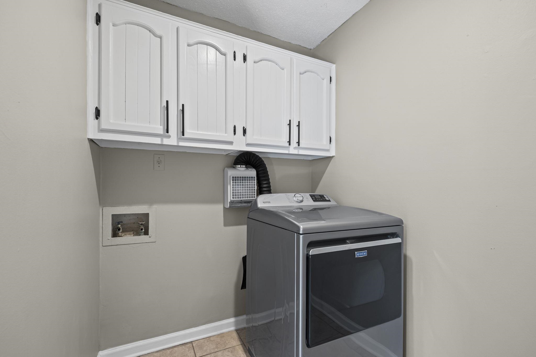 1942 Allenby Road Germantown, TN 38139 - Photo 17 of 34 a view of storage and utility room with washer and dryer