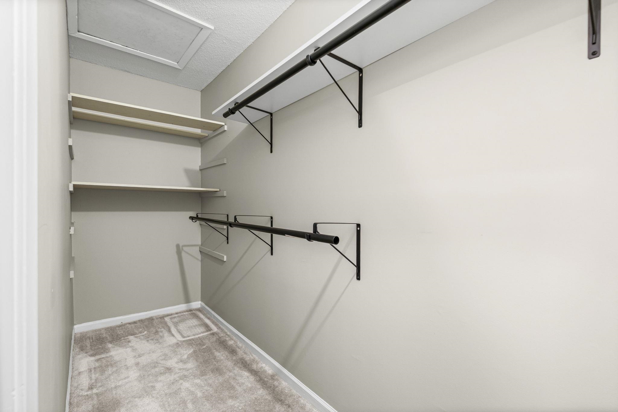 1942 Allenby Road Germantown, TN 38139 - Photo 21 of 34 Walk in closet featuring attic access and light colored carpet