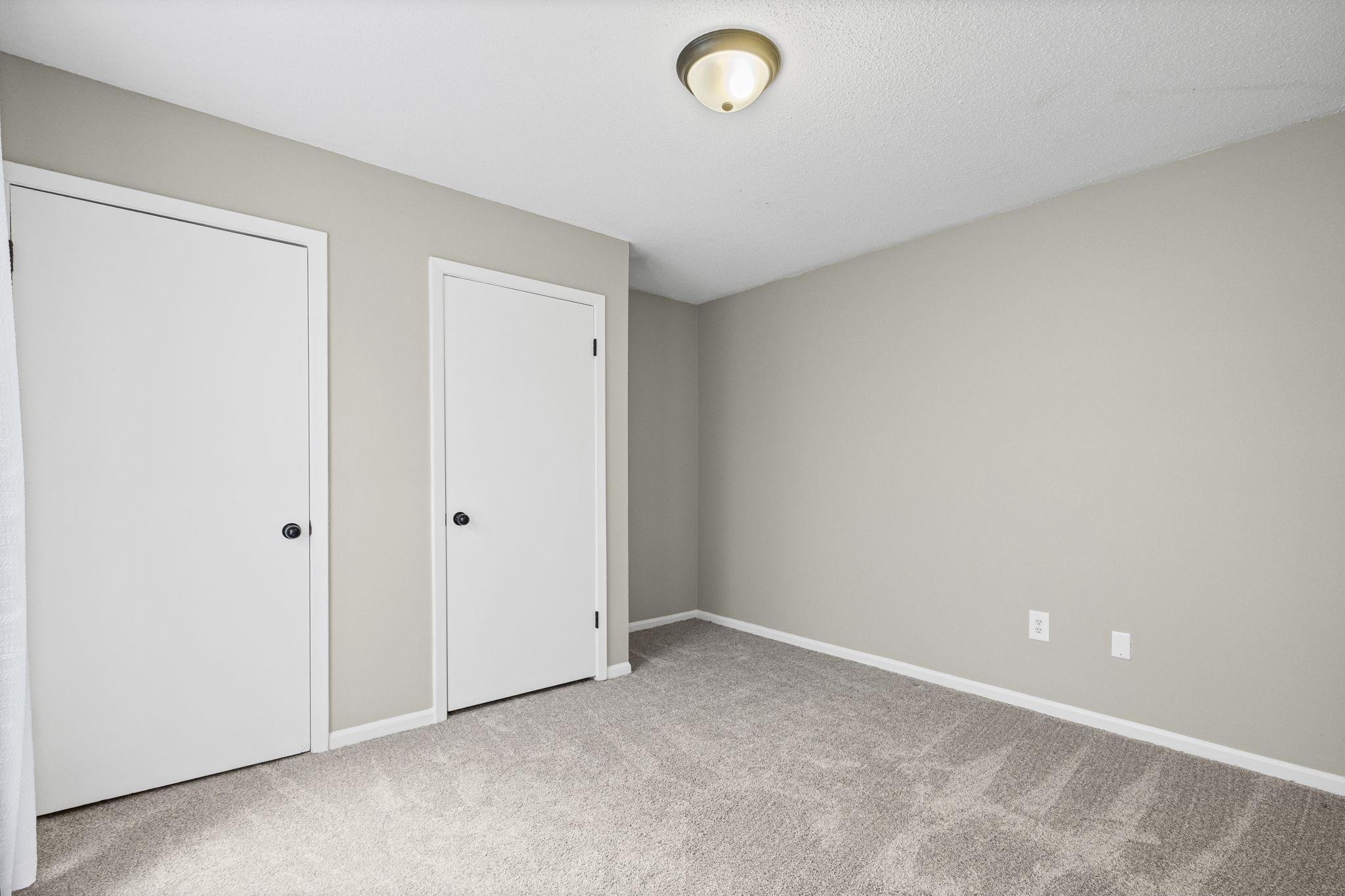 1942 Allenby Road Germantown, TN 38139 - Photo 25 of 34 Unfurnished bedroom with light colored carpet and baseboards