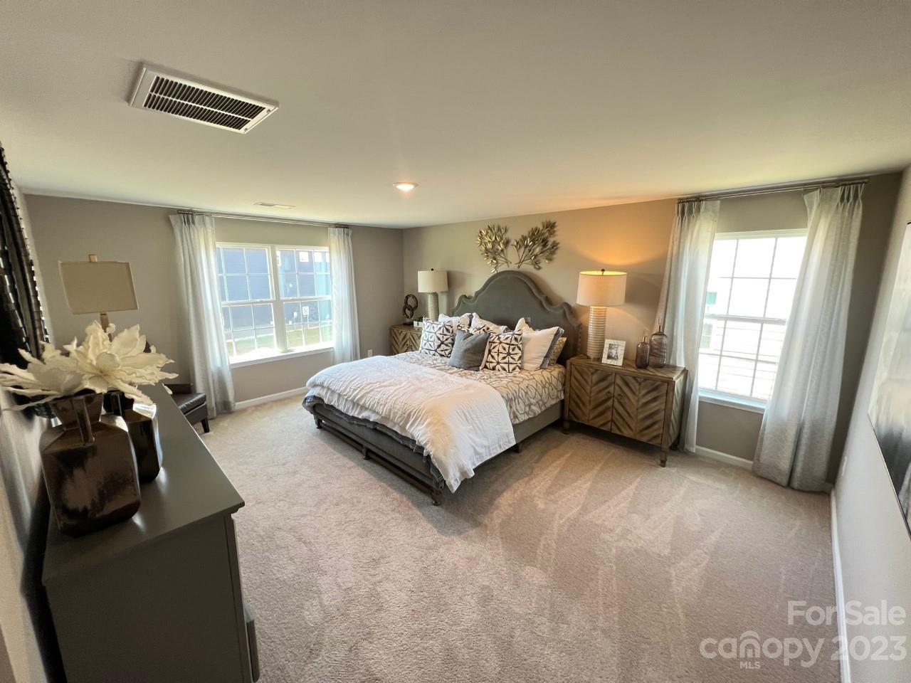 1612 Corwin Bend Road, Unit 2 Tega Cay, SC 29708 - Photo 6 of 7 a bedroom with a bed and a couch