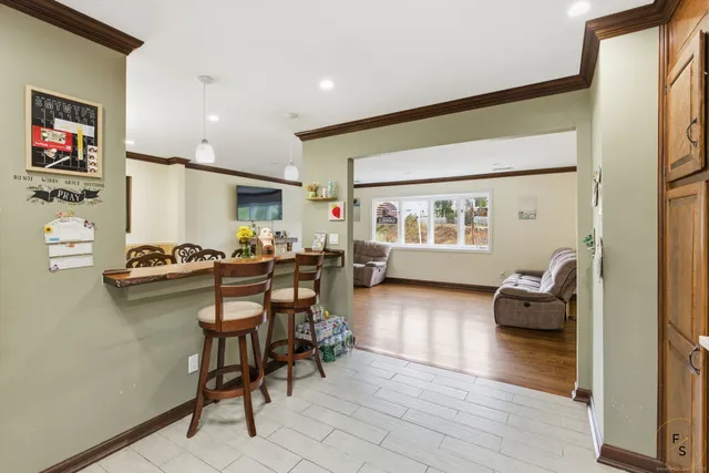 a workspace with furniture and a wooden floor