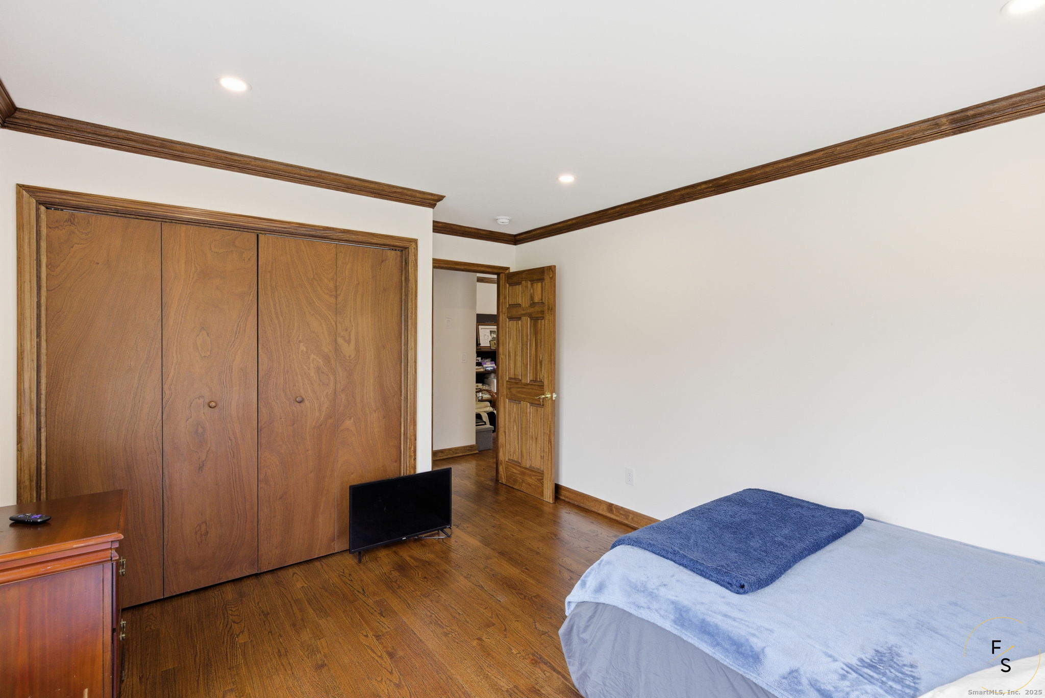 29 Priscilla Road Norwalk, CT 06850 - Photo 16 of 40 a hallway with wooden floor and a cabinet