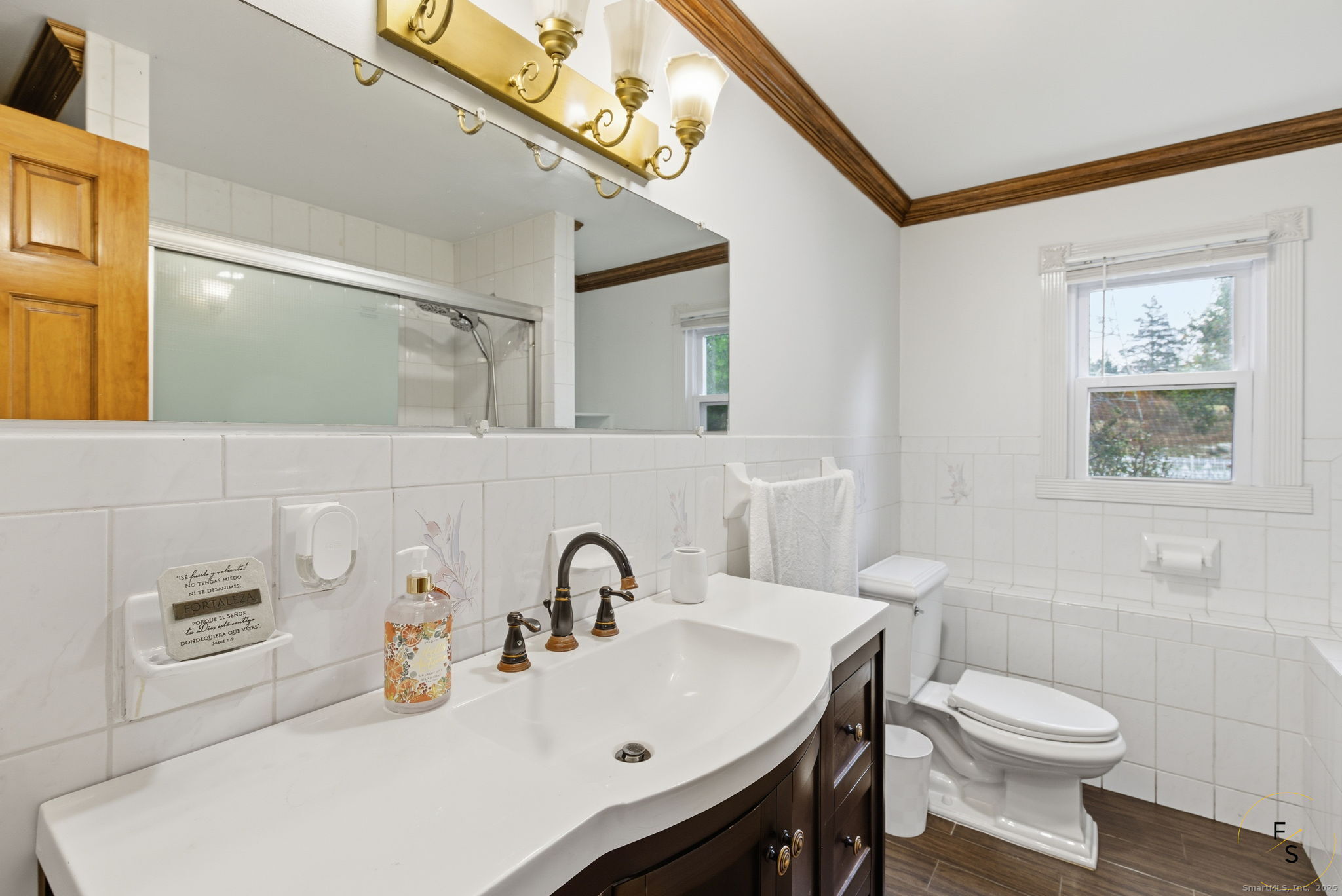 29 Priscilla Road Norwalk, CT 06850 - Photo 28 of 40 a bathroom with a sink a toilet and mirror