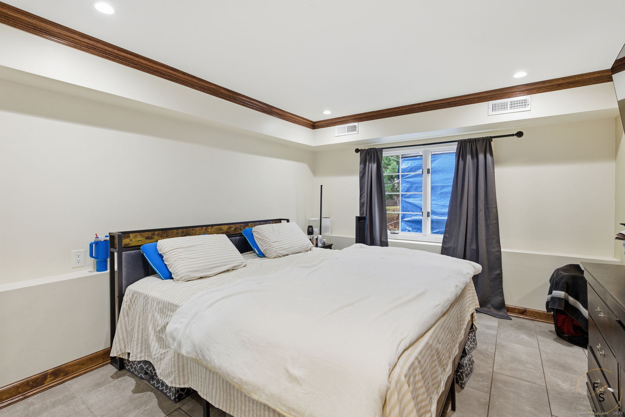 29 Priscilla Road Norwalk, CT 06850 - Photo 29 of 40 a bedroom with a bed and a dresser