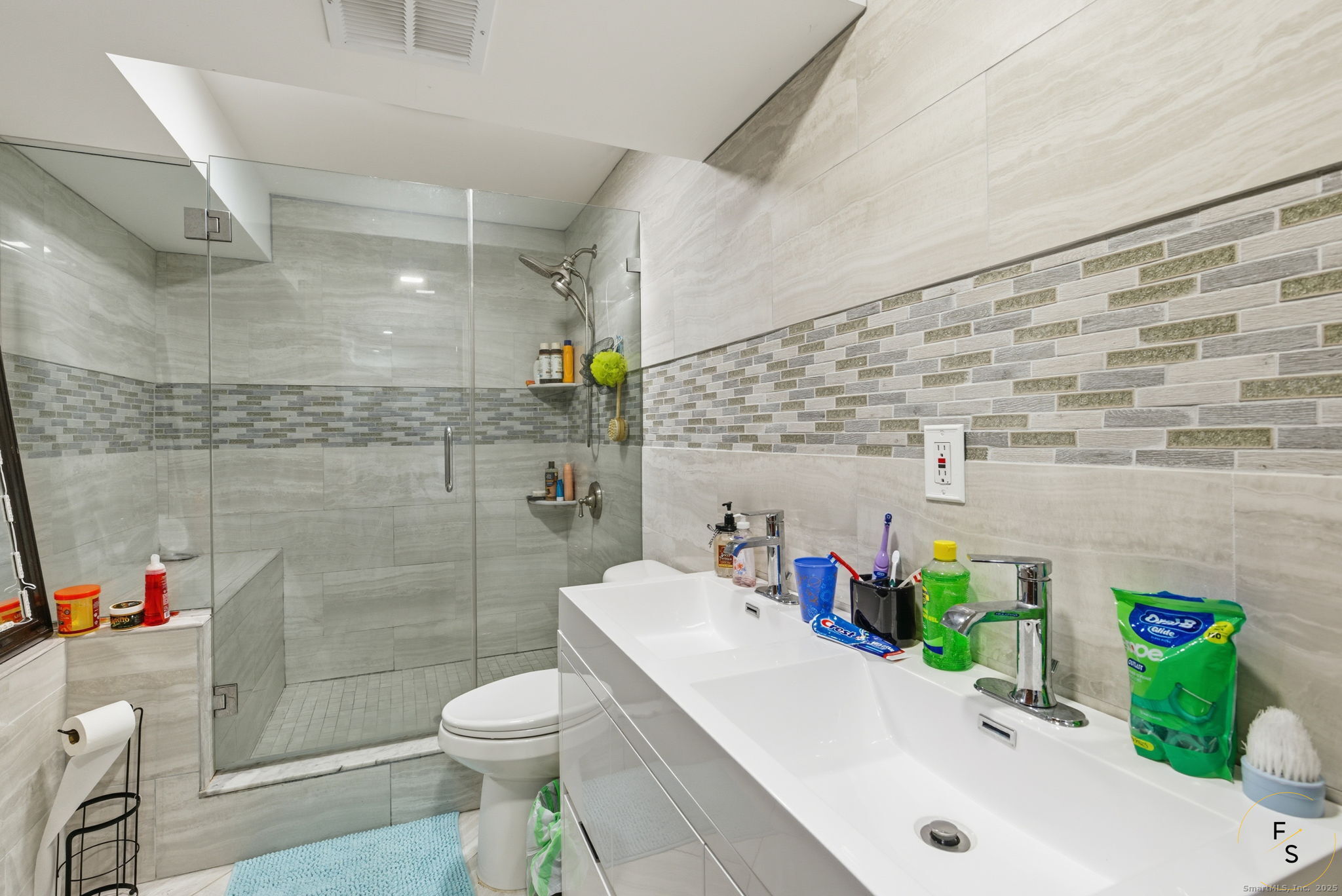 29 Priscilla Road Norwalk, CT 06850 - Photo 30 of 40 a bathroom with a sink a toilet and shower