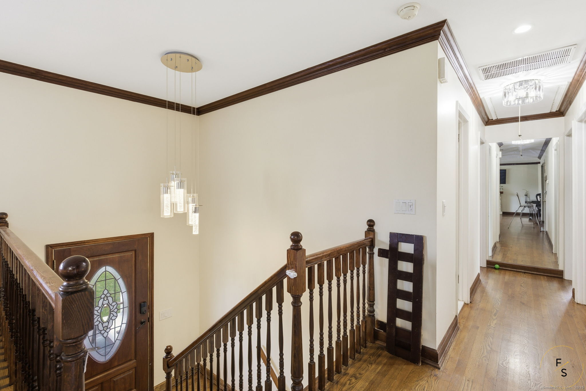 29 Priscilla Road Norwalk, CT 06850 - Photo 6 of 40 a view of a hallway with wooden floor and stairs