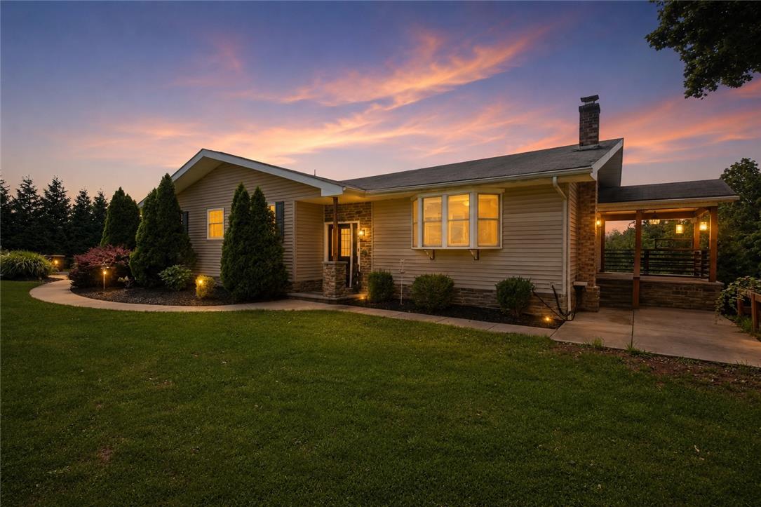 463 North Penn Dixie Road Bath, PA 18014 - Photo 1 of 86 Illuminated by twilight, this home boasts attractive landscaping and a welcoming covered porch.