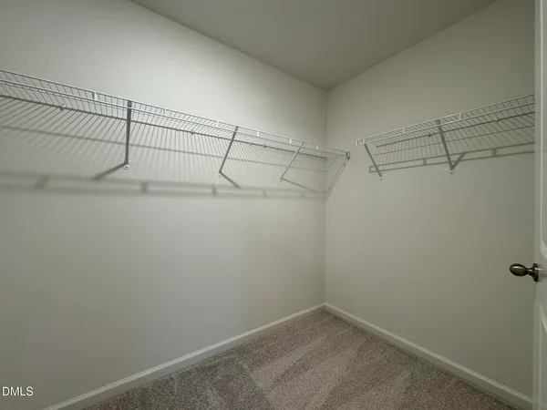 a view of a room with racks on the wall