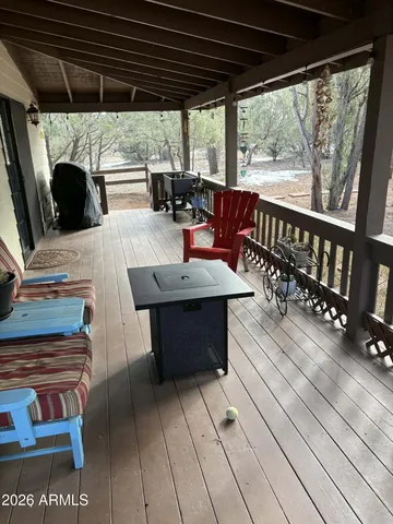 a hallway with front door wooden floor and livingroom