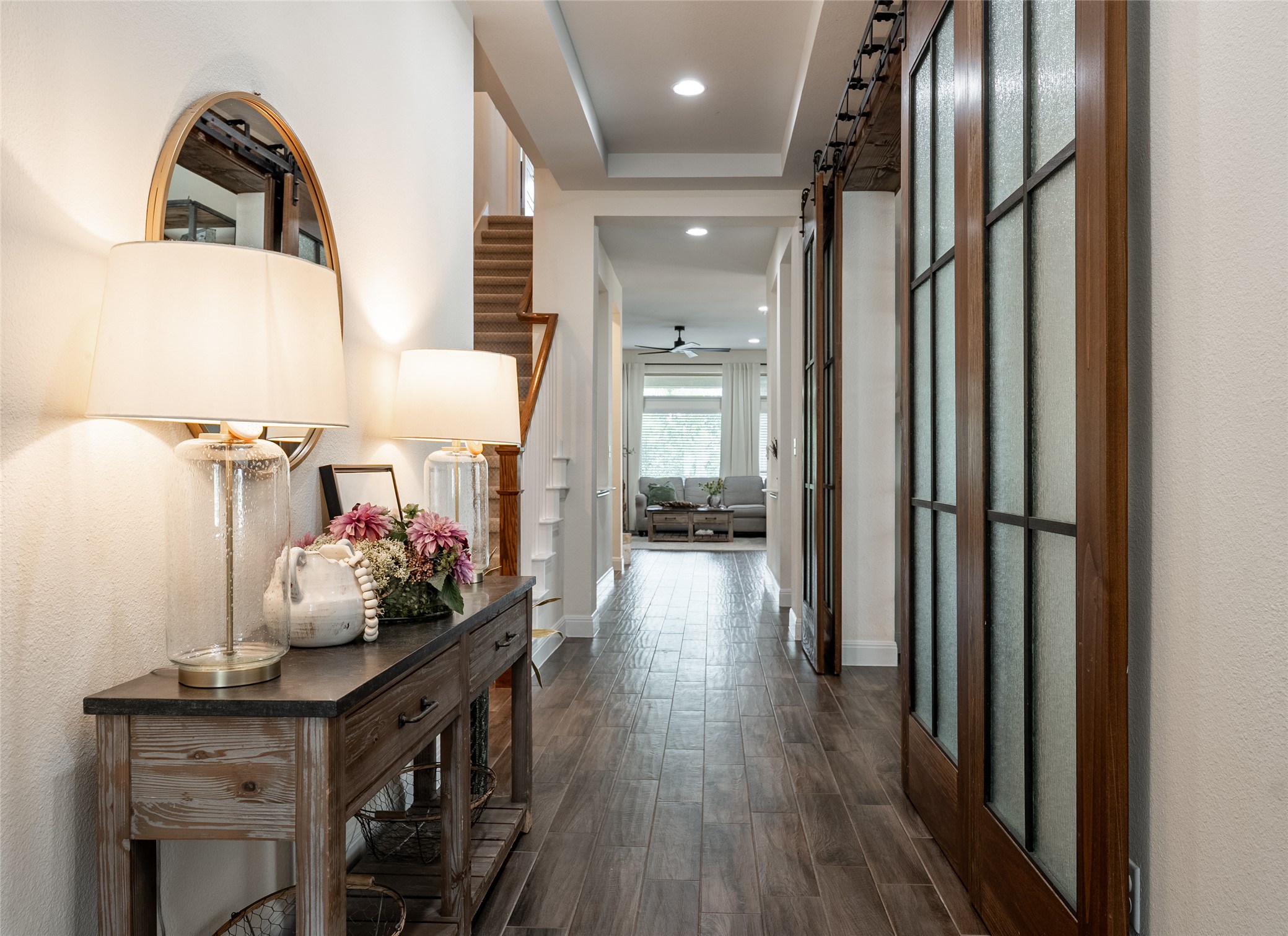 1225 Grassy Field Road Austin, TX 78737 - Photo 15 of 40 Corridor with dark wood finished floors, baseboards, recessed lighting, and a barn door