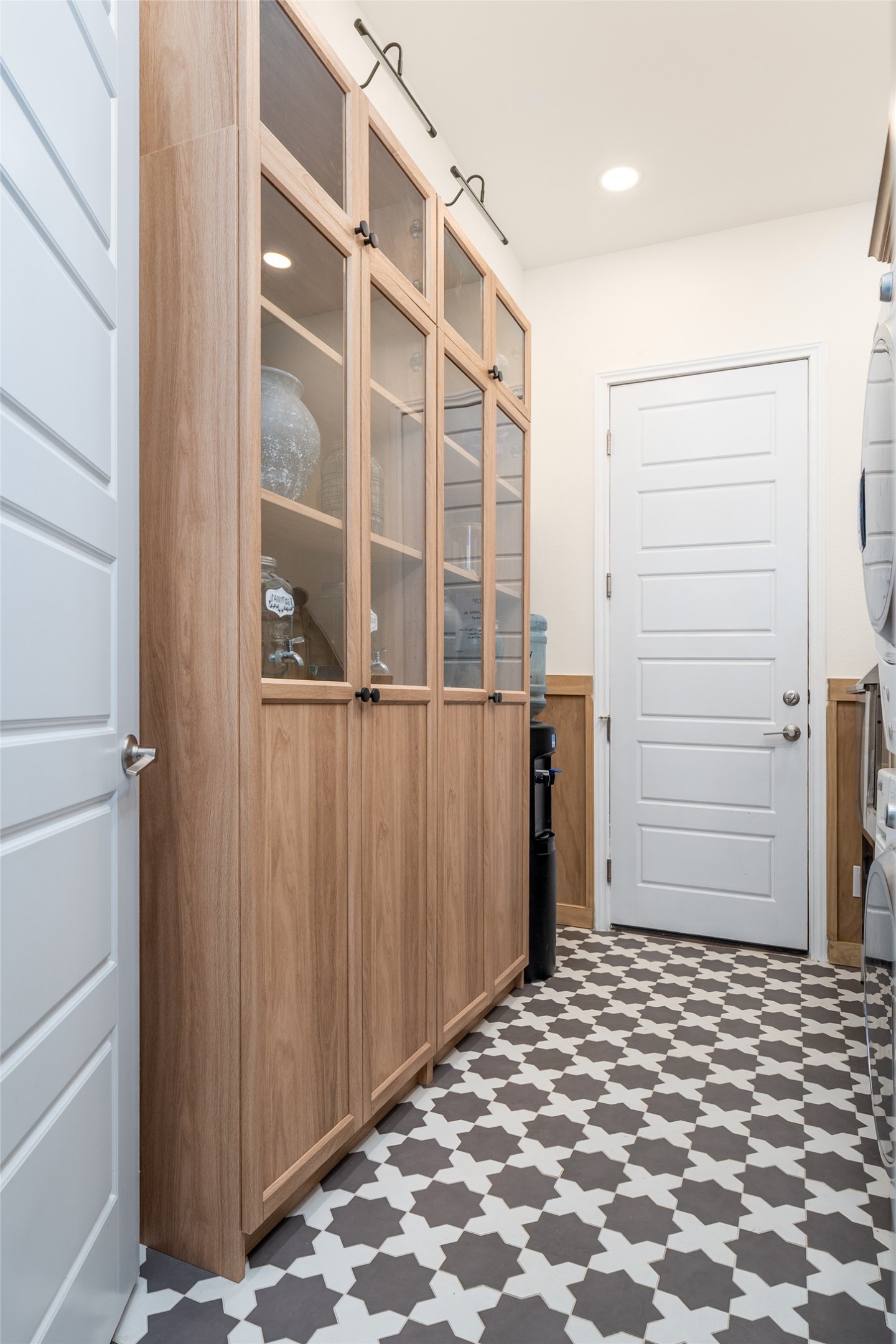 1225 Grassy Field Road Austin, TX 78737 - Photo 19 of 40 Mudroom with tile patterned floors and wainscoting