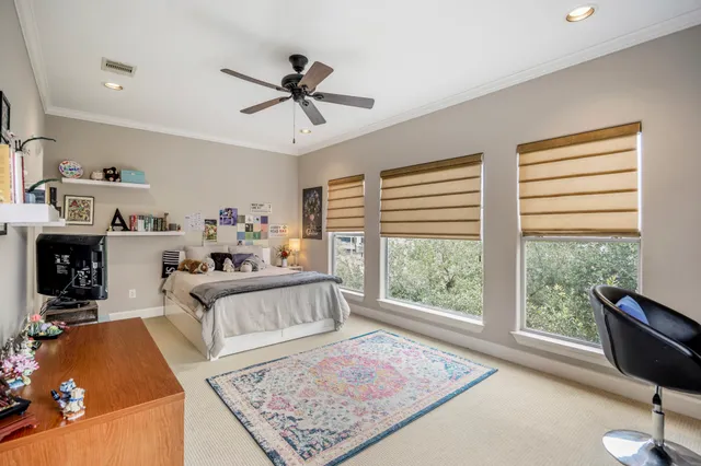 a bathroom with a granite countertop toilet sink and mirror