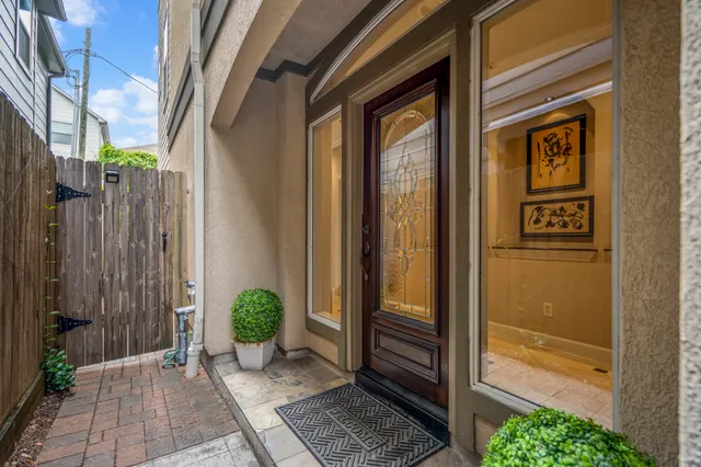 a front view of a house with yard and parking