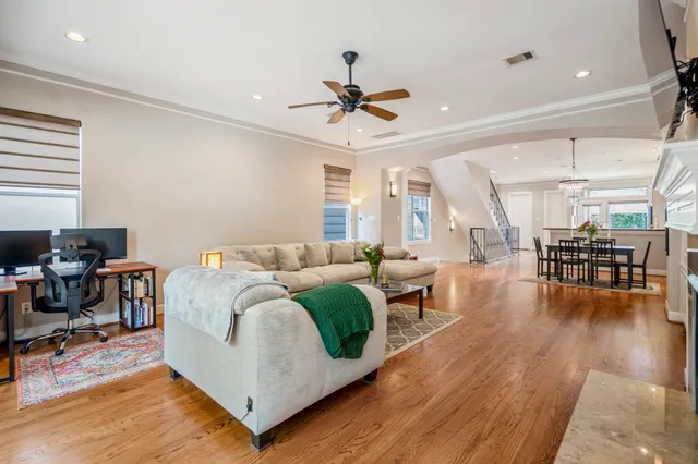 a kitchen with stainless steel appliances granite countertop a stove a sink a refrigerator and a cabinets