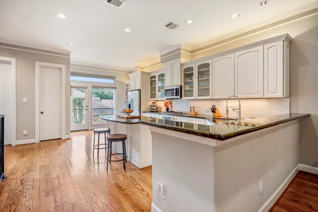 a kitchen with stainless steel appliances a refrigerator and a sink