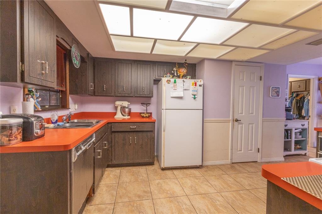 2641 Southeast 45th Street Ocala, FL 34480 - Photo 14 of 36 a kitchen with refrigerator and cabinets