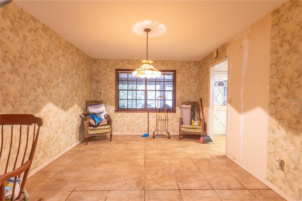 2641 Southeast 45th Street Ocala, FL 34480 - Photo 16 of 36 a living room with furniture and a large window