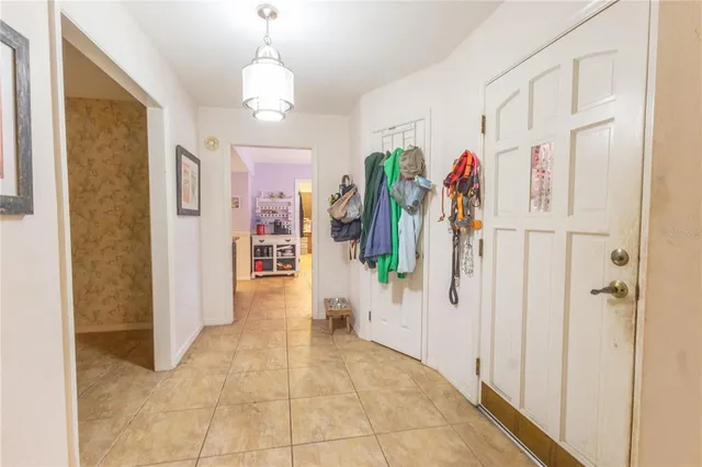 a view of an entryway door and hallway