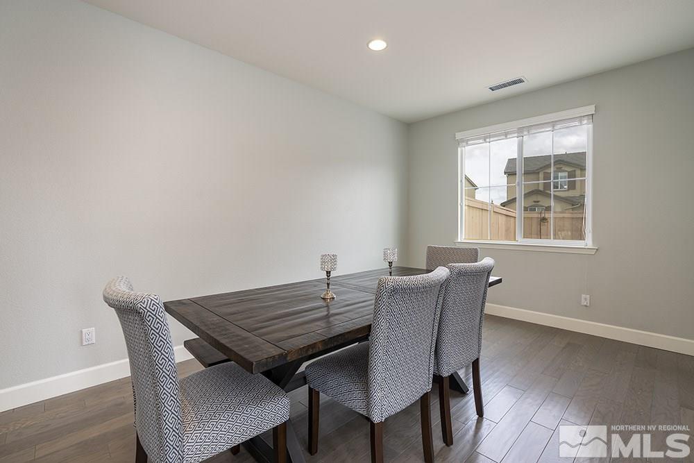 2180 Blue Oaks Drive Reno, NV 89521 - Photo 11 of 27 a view of a dining room with furniture and wooden floor