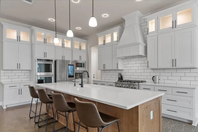 a view of a dining room with furniture a chandelier and wooden floor