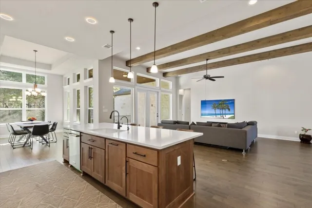 a bathroom with a tub sink and mirror