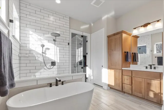 a bedroom with a bed lamp and window