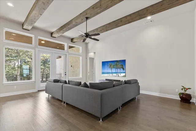 a kitchen with stainless steel appliances granite countertop a stove a sink a oven a dining table and chairs