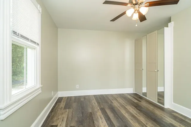 a bathroom with a sink vanity and shower