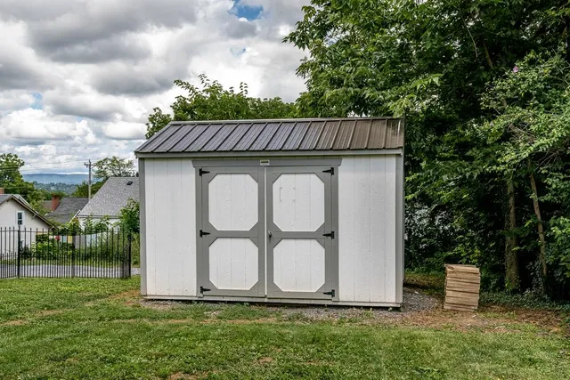 a wooden house with a yard