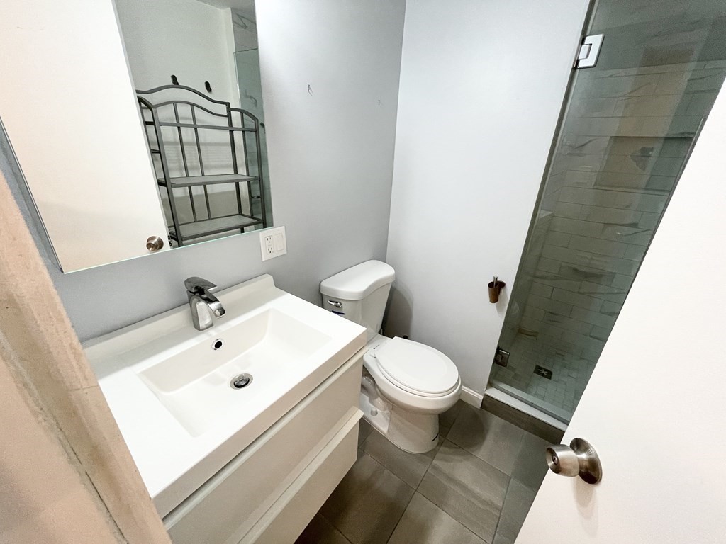 39 Hemenway Street, Unit 26 Boston, MA 02115 - Photo 12 of 27 a bathroom with a sink toilet and shower