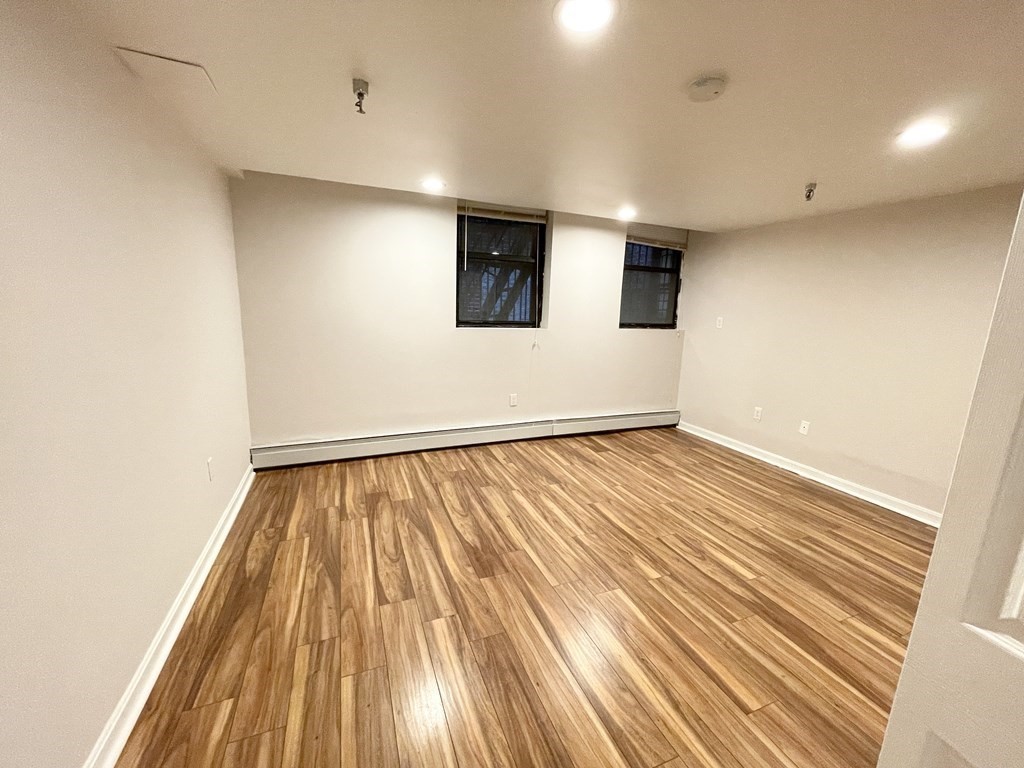 39 Hemenway Street, Unit 26 Boston, MA 02115 - Photo 20 of 27 a view of empty room with wooden floor