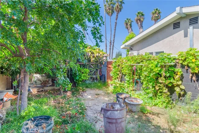 a wooden fence with some plants