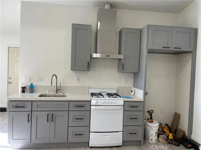 a room with cabinets appliances washer and dryer