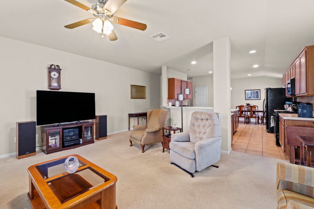 12008 Lansdowne Road Austin, TX 78754 - Photo 29 of 29 An inviting open floorplan seamlessly connects the comfortable living area to the well-appointed kitchen.