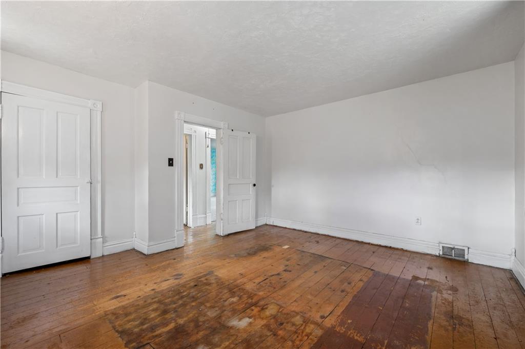 272 Shaffer Road Beaver Falls, PA 15010 - Photo 20 of 38 a view of an empty room and wooden floor