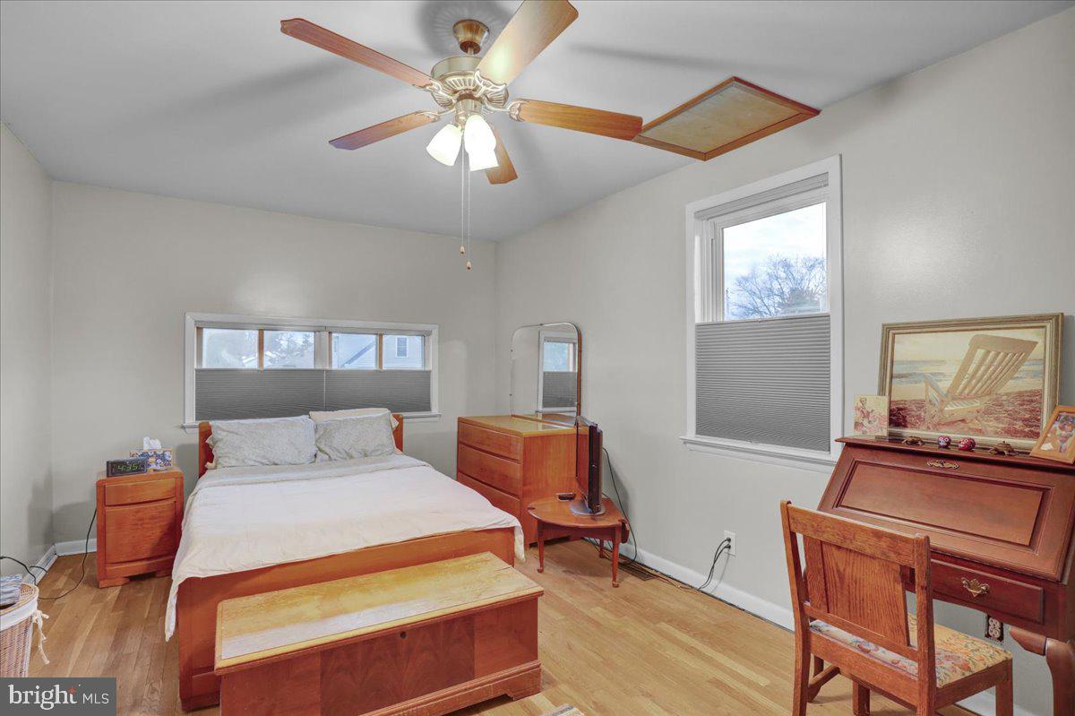 329 Dahlia Road Lancaster, PA 17602 - Photo 11 of 24 a bedroom with a bed and wooden floor