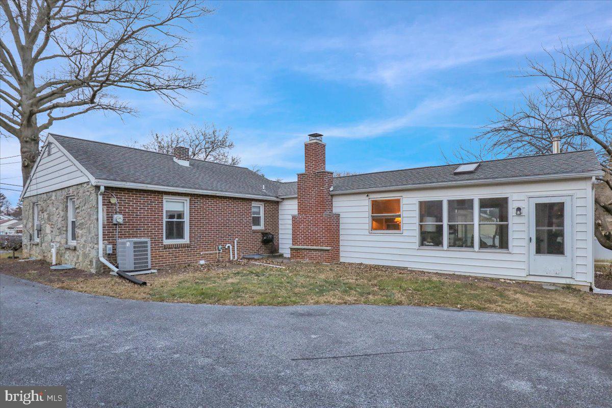 329 Dahlia Road Lancaster, PA 17602 - Photo 22 of 24 a front view of a house with a yard and garage