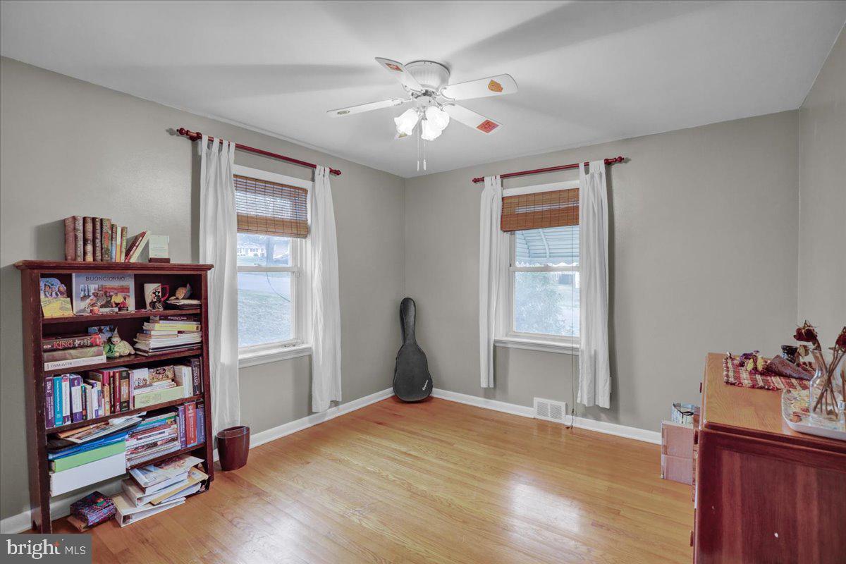 329 Dahlia Road Lancaster, PA 17602 - Photo 8 of 24 a bedroom with furniture and a book shelf