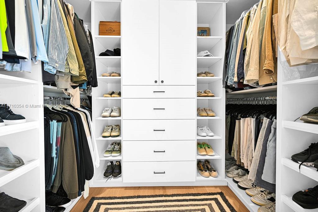 364 Southwest 30th Road Miami, FL 33129 - Photo 19 of 38 a view of walk in closet with clothes and shoes