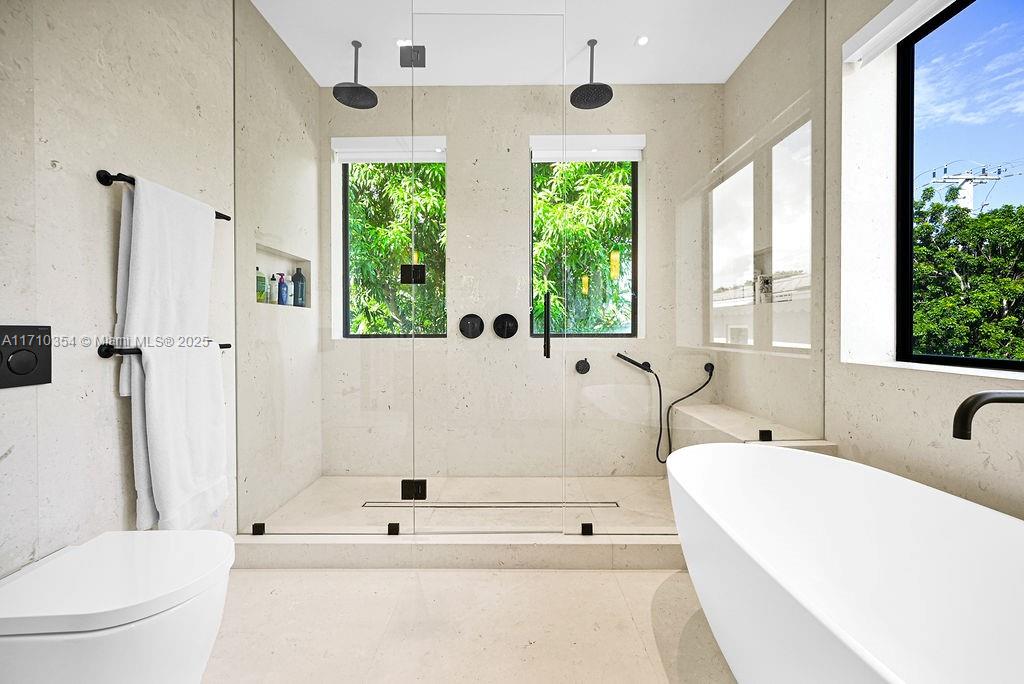 364 Southwest 30th Road Miami, FL 33129 - Photo 20 of 38 a bathroom with a bathtub and a shower