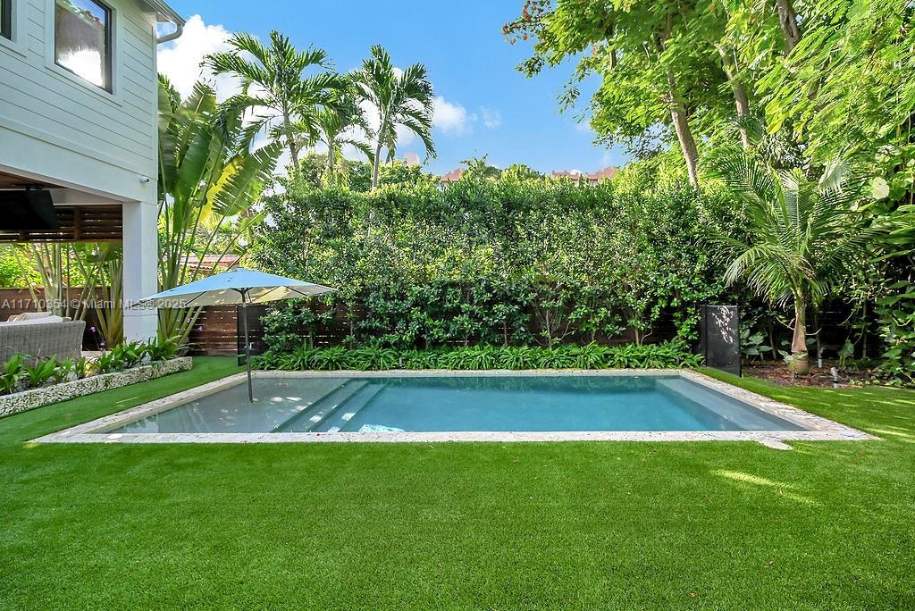 364 Southwest 30th Road Miami, FL 33129 - Photo 34 of 38 a view of a backyard with swimming pool
