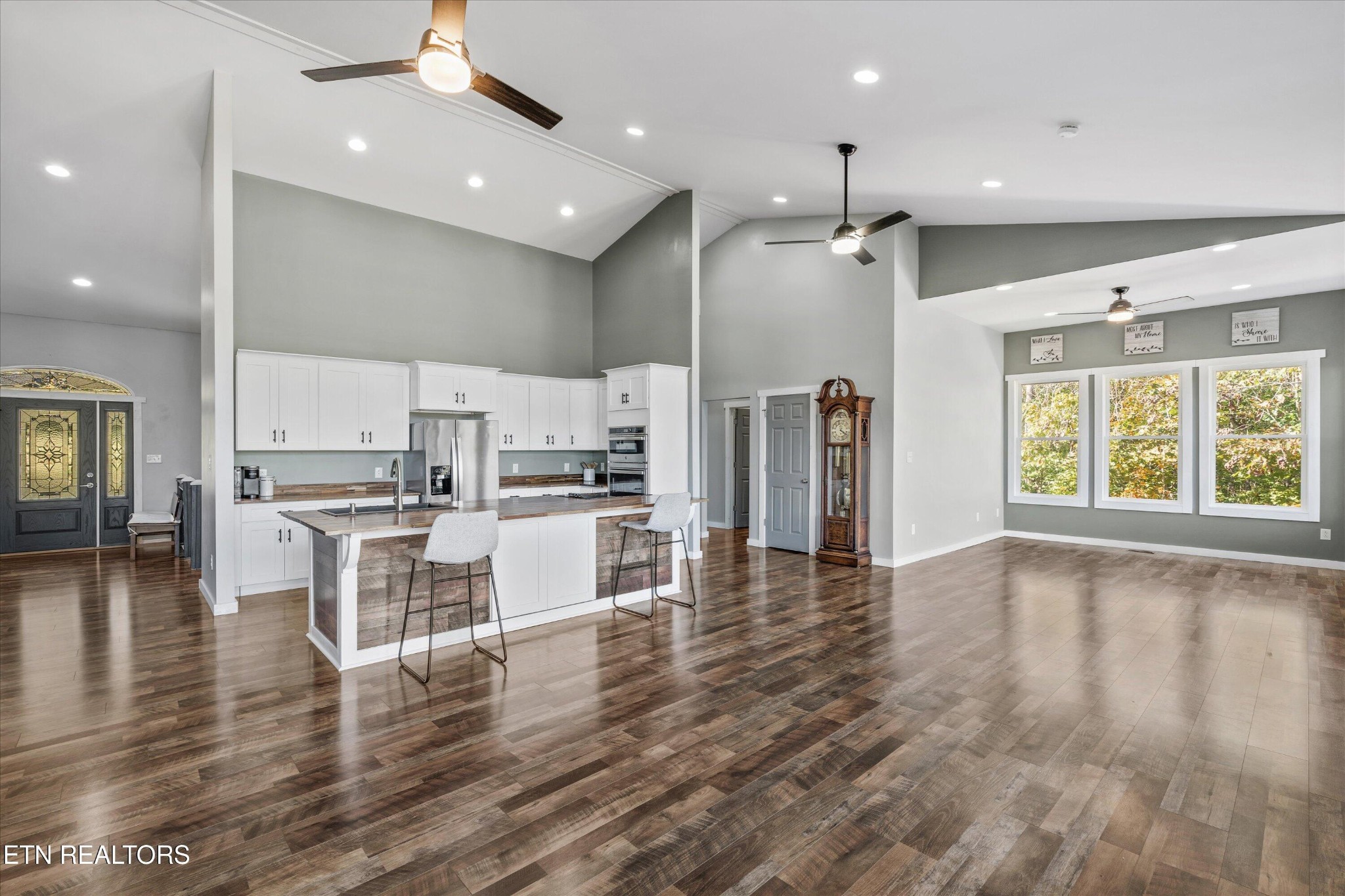620 East Norris Point Road La Follette, TN 37766 - Photo 14 of 48 an open kitchen with white cabinets and stainless steel appliances