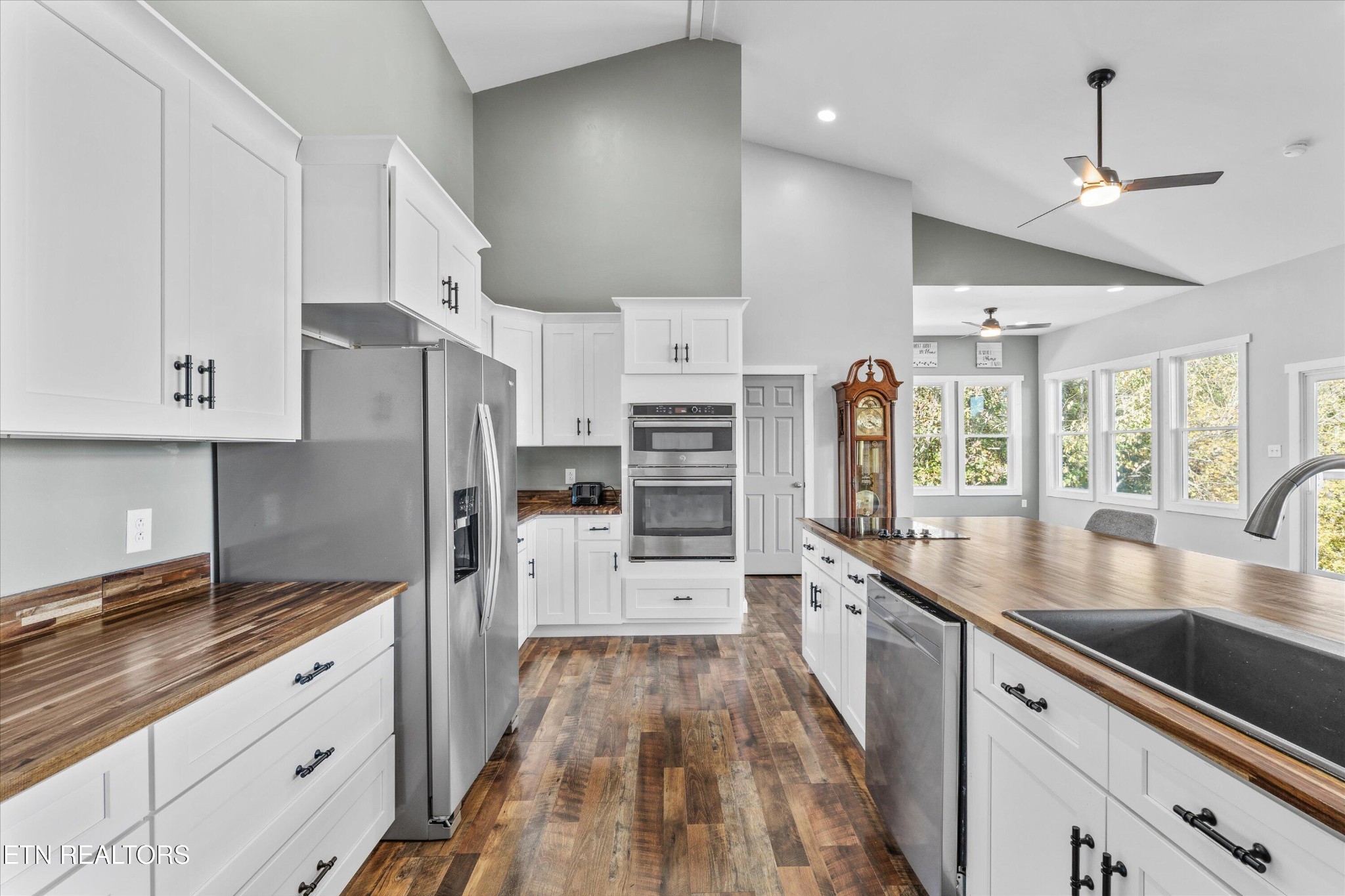 620 East Norris Point Road La Follette, TN 37766 - Photo 19 of 48 a large kitchen with stainless steel appliances a large counter top a stove a refrigerator and a sink