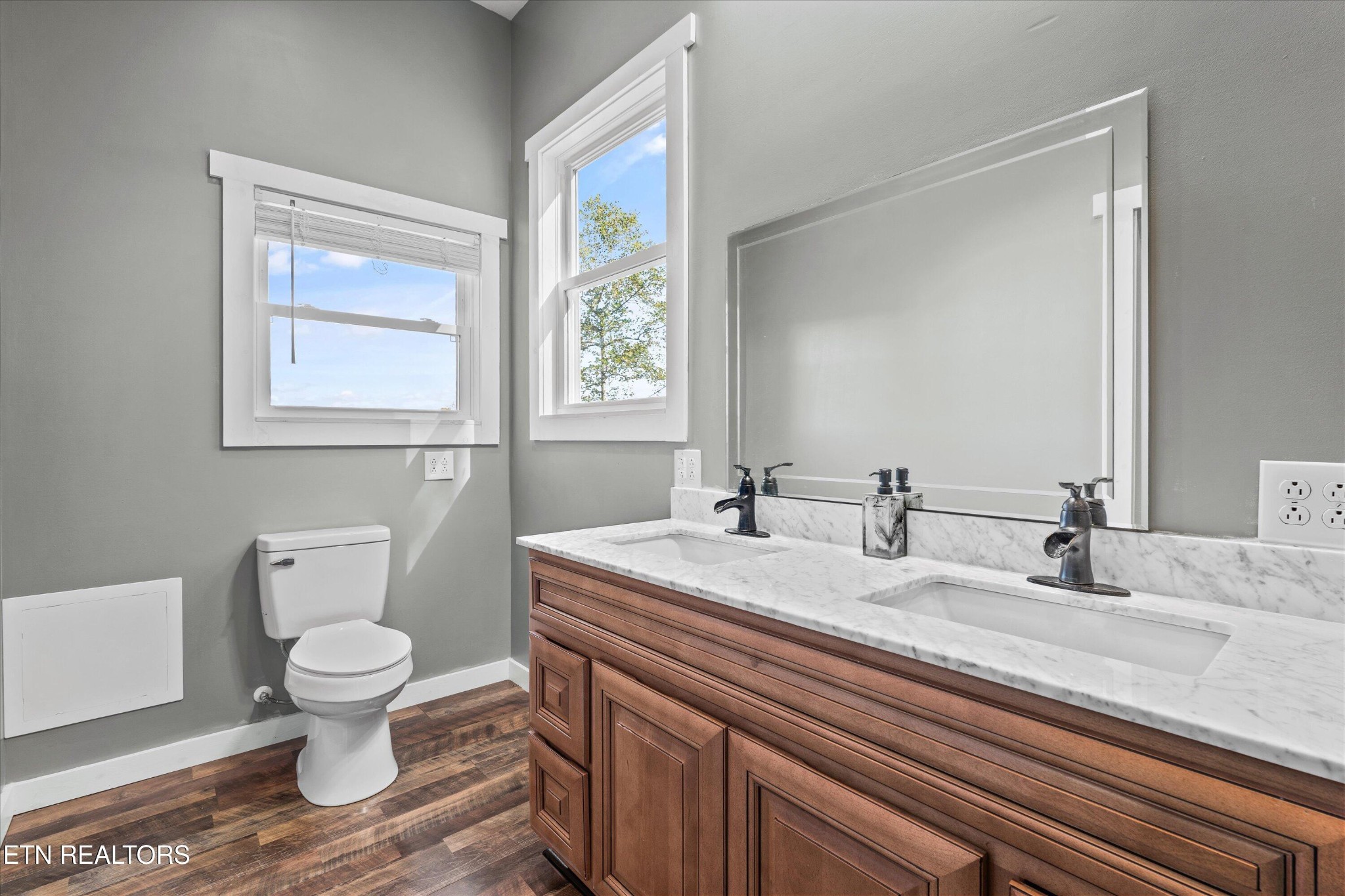 620 East Norris Point Road La Follette, TN 37766 - Photo 26 of 48 a bathroom with a granite countertop sink mirror and toilet