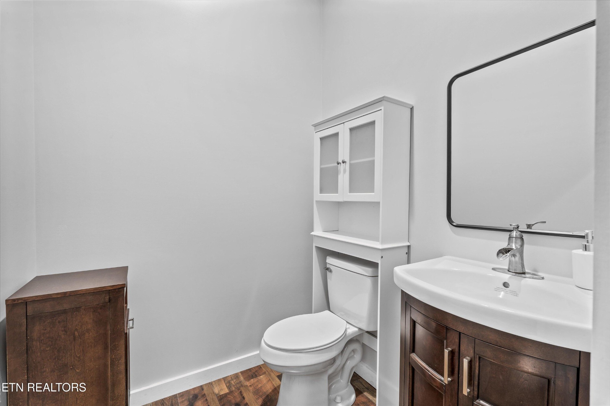 620 East Norris Point Road La Follette, TN 37766 - Photo 32 of 48 a bathroom with a sink toilet and a mirror