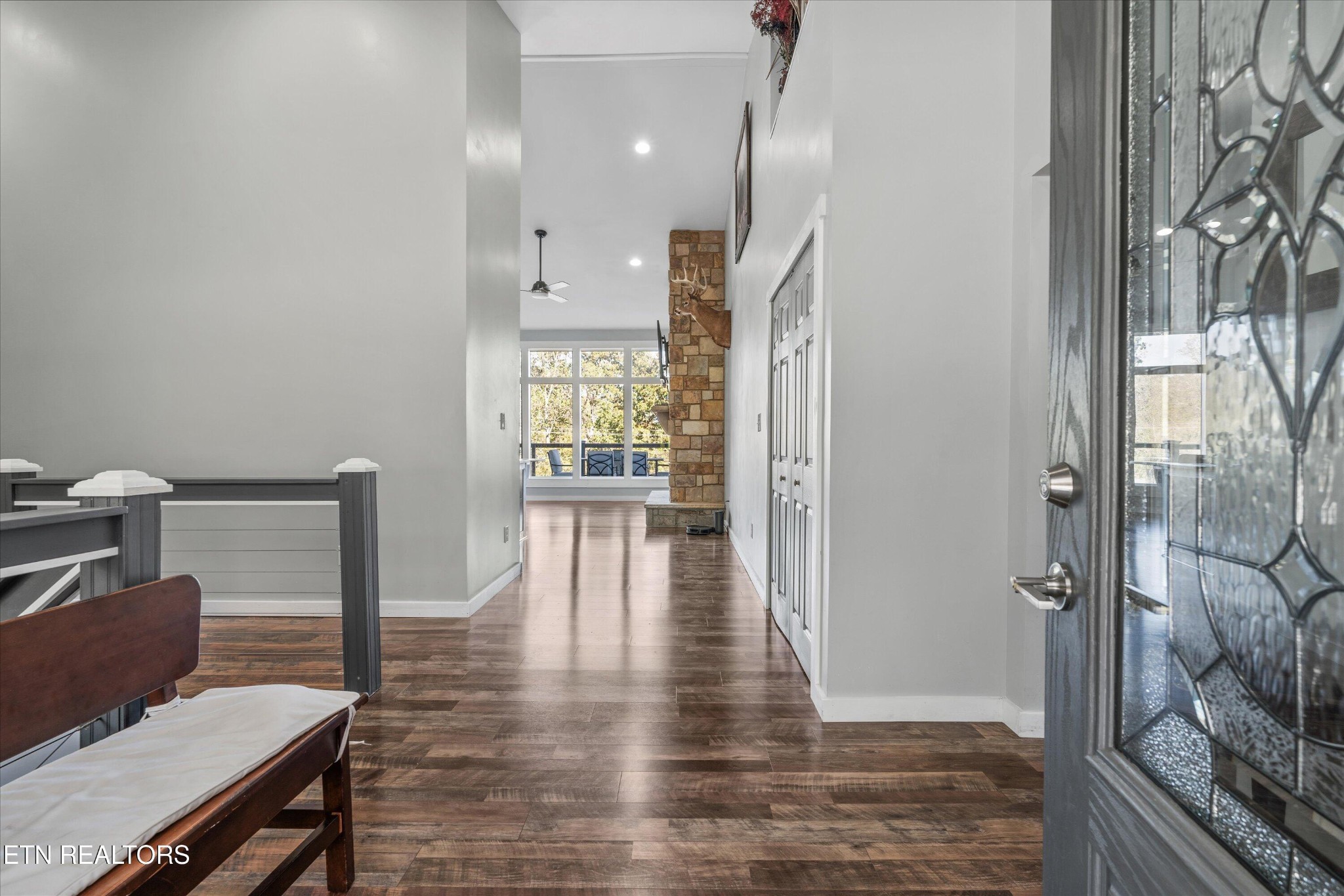620 East Norris Point Road La Follette, TN 37766 - Photo 10 of 48 a view of a hallway view with wooden floor and staircase