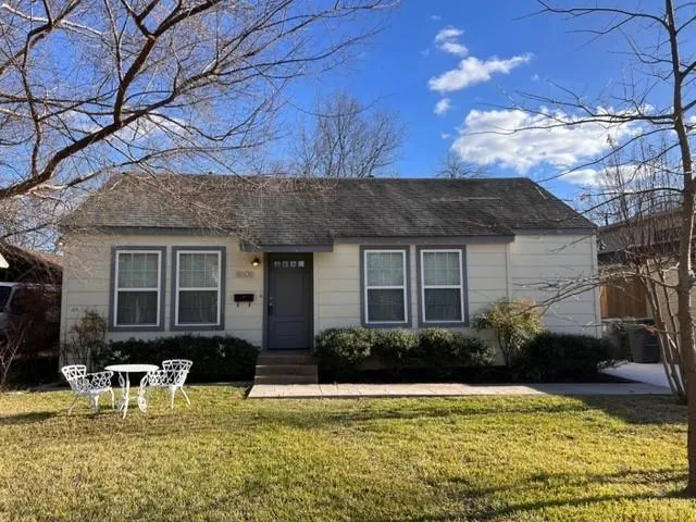 a view of a house with swimming pool and furniture